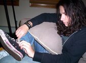 Mike's serious about tying her shoes.jpg