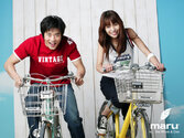 Jung Hwa Kim in Black All Stars on Bike.jpg