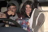 Louis+Tomlinson+and+girlfriend+Eleanor+Calder+One+Direction+arriving+at+Heathrow+Airport.jpg