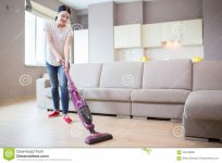 picture-woman-stands-studio-apartment-cleaning-floor-uses-vacuum-cleaner-girl-looking-down-124...jpg