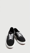 pikaso_texttoimage_pair-of-womens-black-Keds-sneakers-have-a-simple-s.jpeg