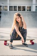 photo-of-woman-sitting-on-skateboard-1755257.jpg