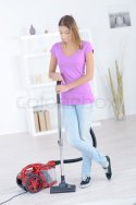 24043661-woman-stood-with-a-vacuum-cleaner.jpg