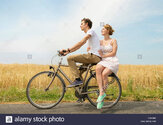 couple-riding-bicycle-DGK9N9.jpg