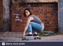 young-skater-woman-riding-on-her-longboard-in-the-village-in-casual-wearing-freedom-concept-2B...jpg