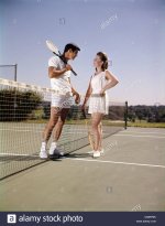 1960-1960s-retro-smiling-couple-man-woman-standing-on-opposite-sides-CMRP9K.jpg