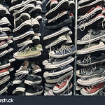stock-photo-a-large-pile-of-old-worn-sneakers-shoes-251100226.jpg