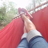 kicking it in a hammock in red keds