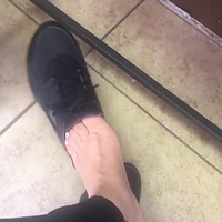 light skin ebony feet takes off shoes.mp4