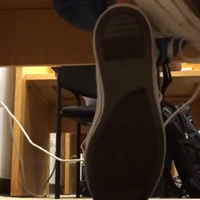 lilia's converse and soles show under table at library.mp4