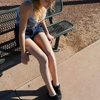 kaelyn taking off her black sneakers and socks.mp4